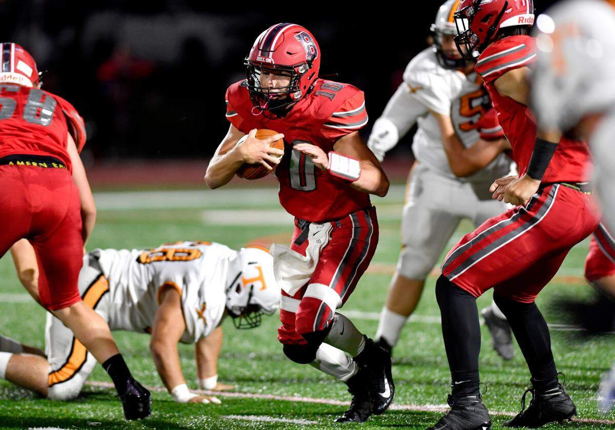 Bellefonte quarterback Nicholas Way runs with the ball during the game against Tyrone on Friday, Sept. 10, 2021.