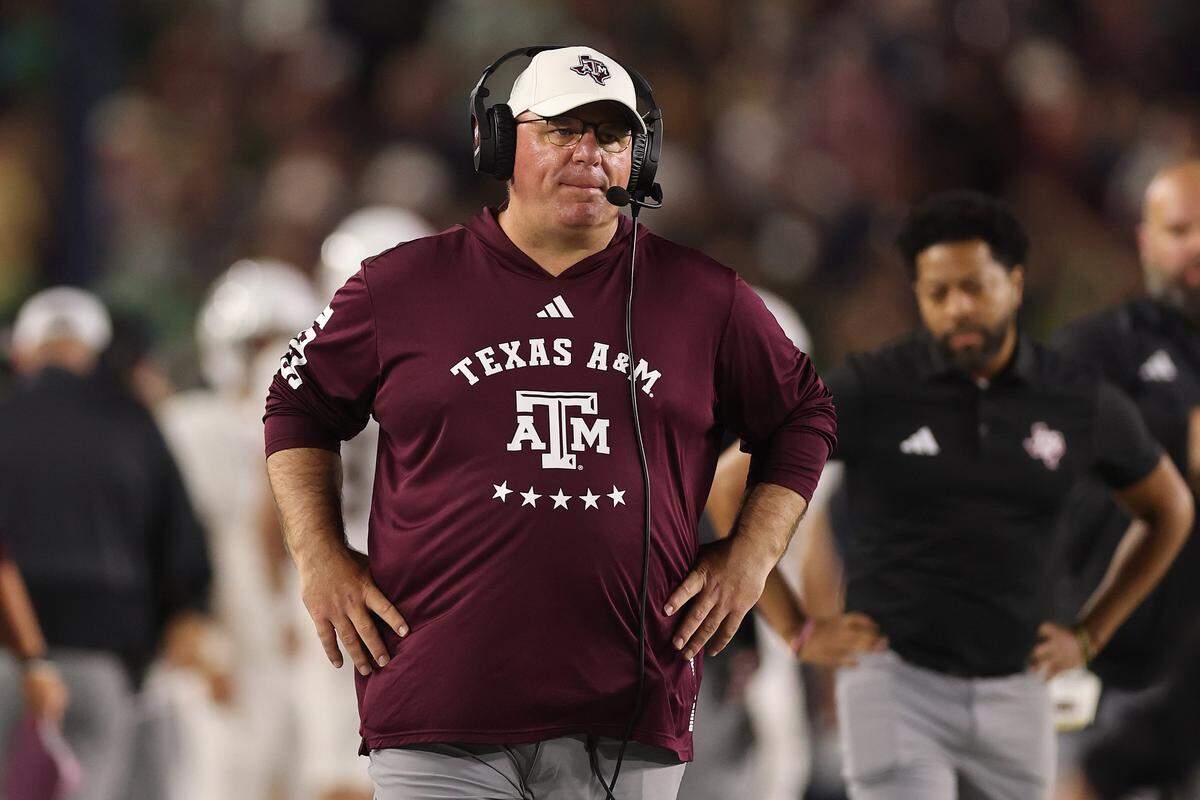 SOUTH BEND, INDIANA - SEPTEMBER 13: Head coach Mike Elko of the Texas A&M Aggies looks on against the Notre Dame Fighting Irish during the first half at Notre Dame Stadium on September 13, 2025 in South Bend, Indiana.  (Photo by Michael Reaves/Getty Images)