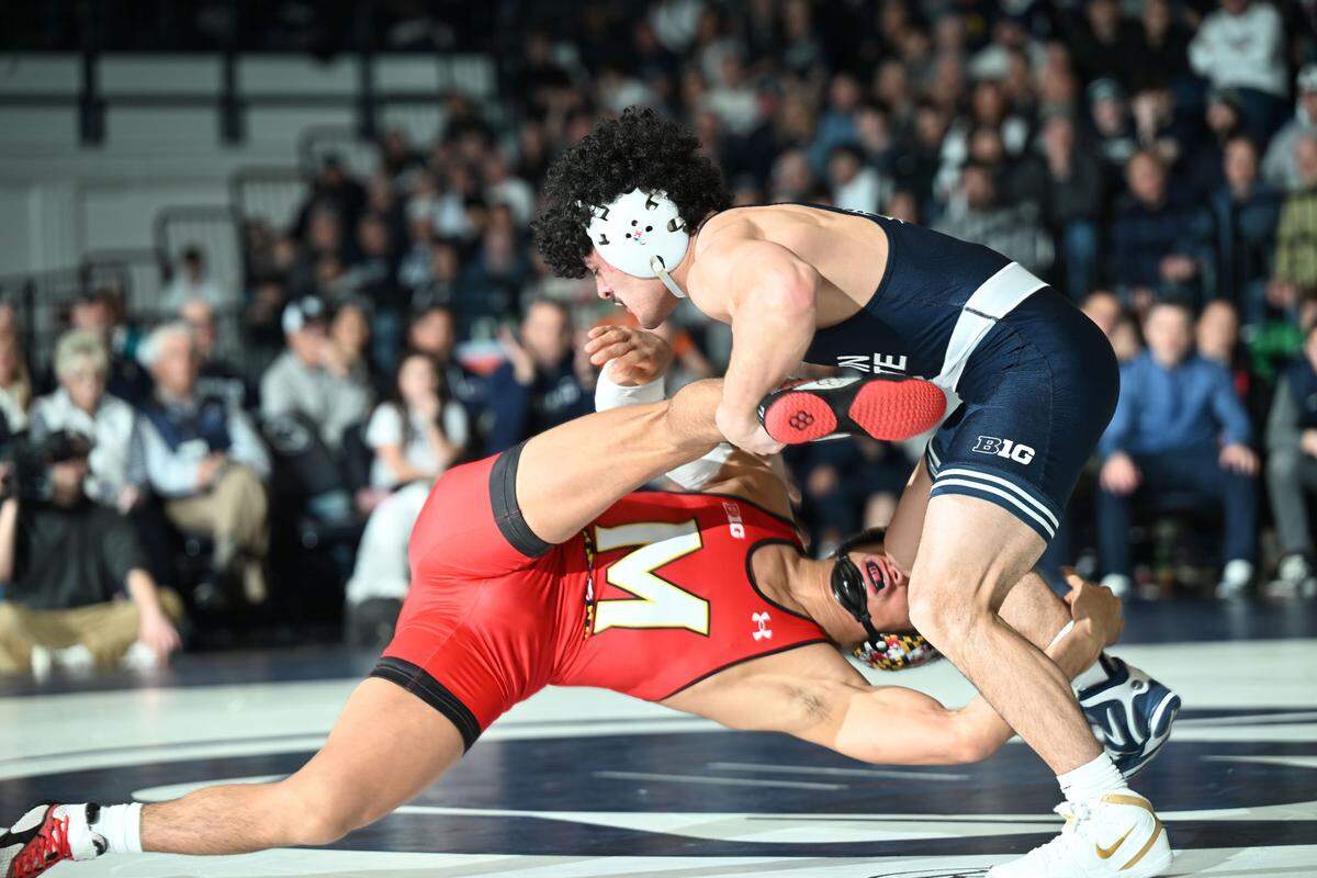 Penn State’s Beau Bartlett takes down Maryland’s Dario Lemus at 141 lbs. during Sunday’s meeting at Rec Hall in State College. Bartlett defeated Lemus, 17-3.