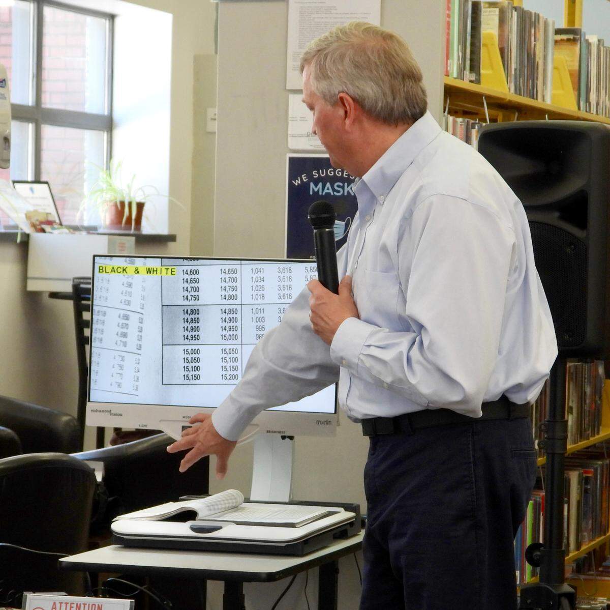 Brandon DeArment, technology specialist at North Central Sight Services, gives a demostration of assistive technology donated to the Centre County Library. The devices will assist people with low vision to better access library materials.