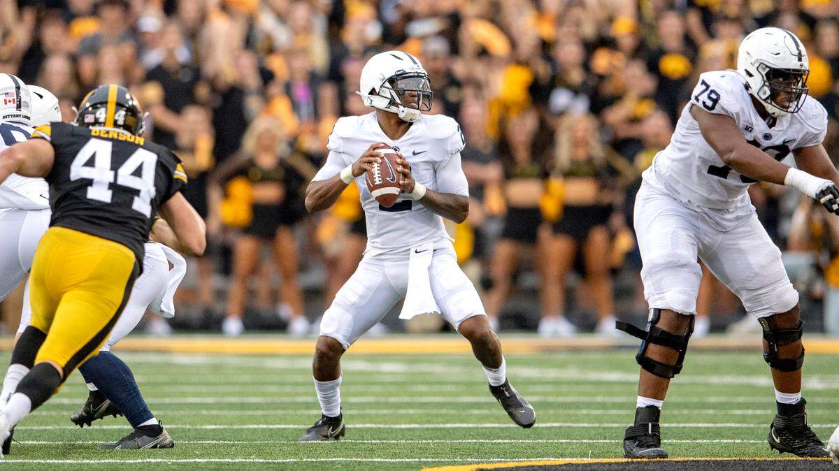 Penn State quarterback Ta’Quan Roberson makes a pass for a first down in the third quarter of the game against Iowa on Saturday, Oct. 9, 2021 at Kinnick Stadium.