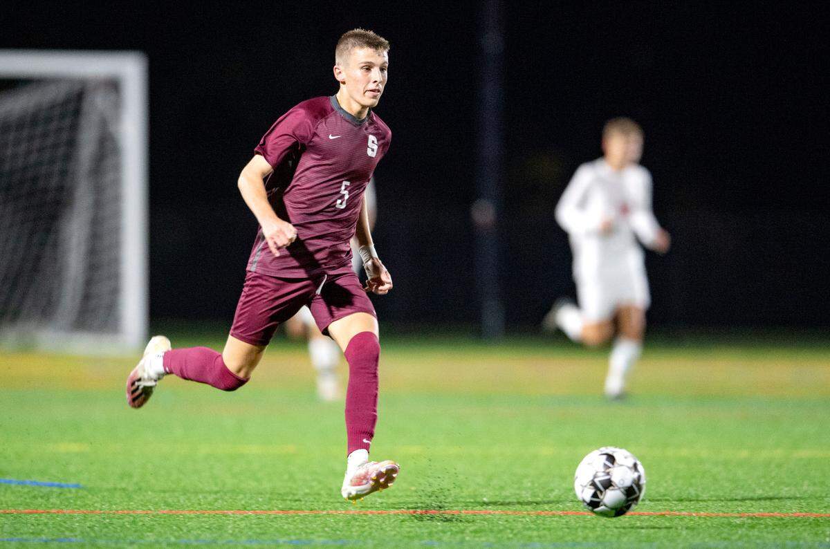 State College’s Davis Pagett dribbles down the field during the game against Red Land on Wednesday, Oct. 13, 2021.