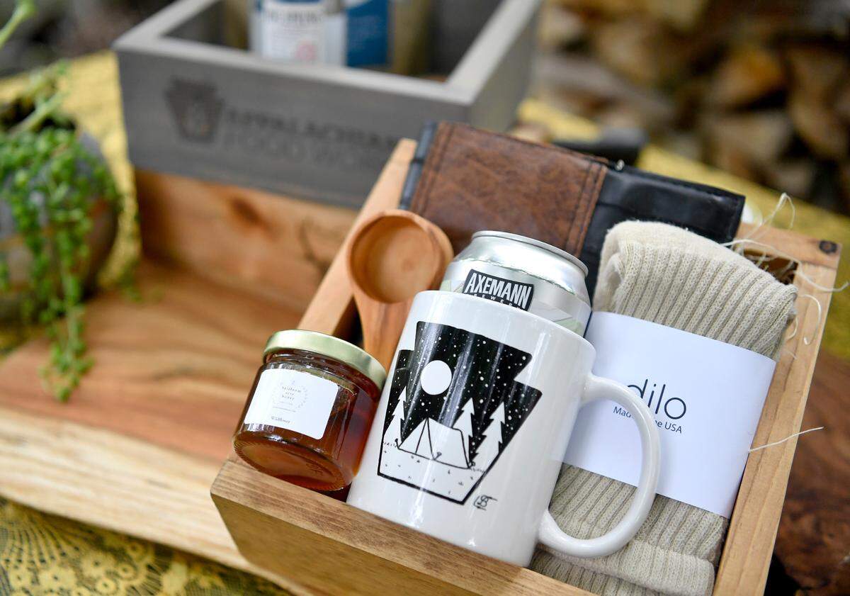 A custom made box from The Giving Box includes Centre County artisan items like a journal from Tubular gear, a beer from Axemann brewery and a scoop from Steve Strouse. All items in the box are from Pennsylvania.