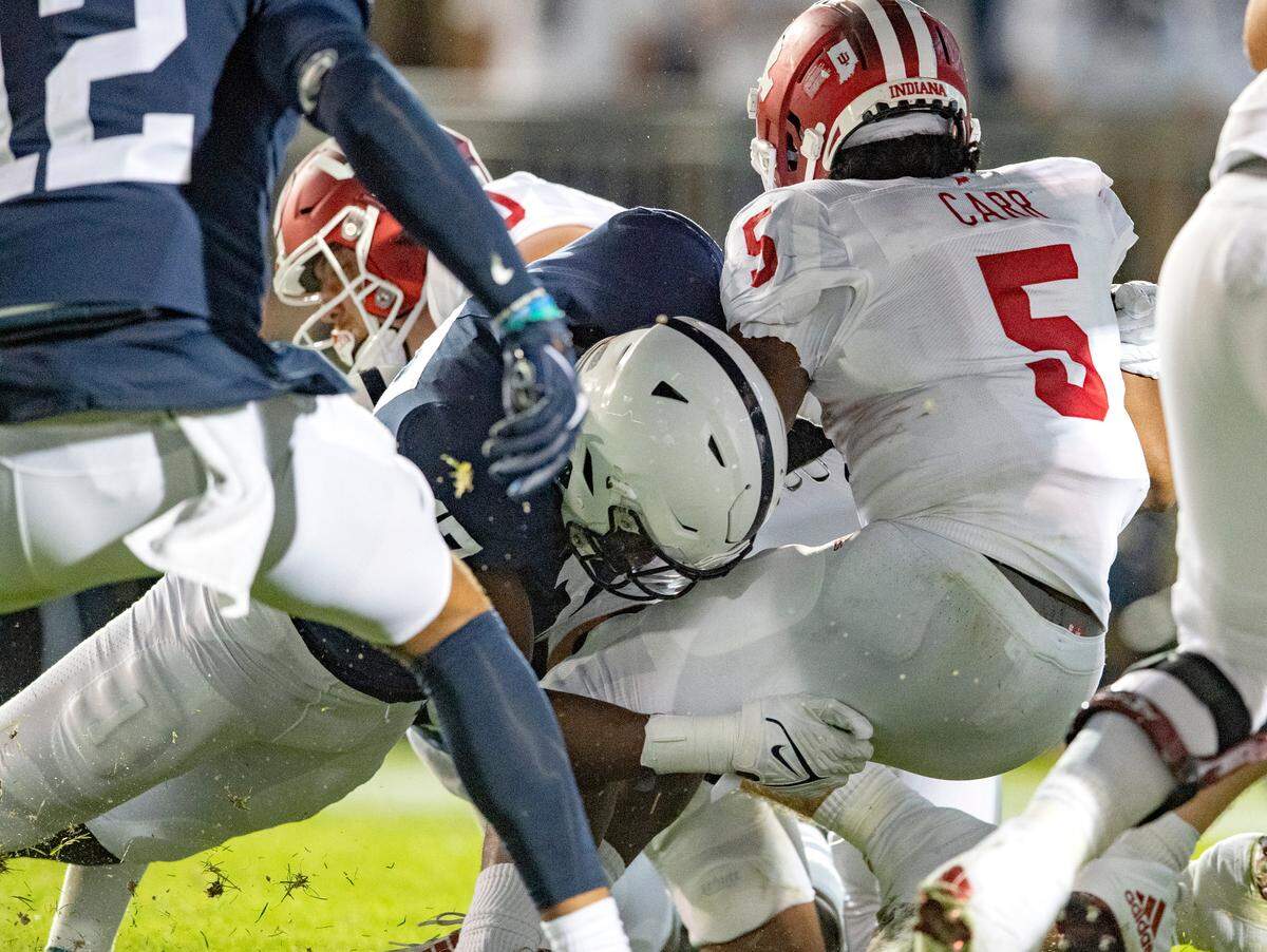 Penn State defensive end Arnold Ebiketie stops Indiana’s Stephen Carr on fourth down.