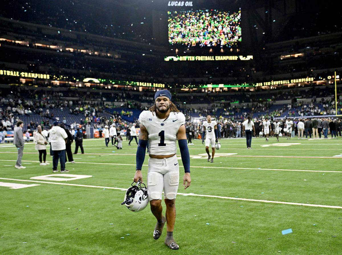 Penn State safety Jaylen Reed walks off the field in disappointment after falling to Oregon in the Big Ten Championship game at Lucas Oil Stadium on Saturday, Dec. 7, 2024.