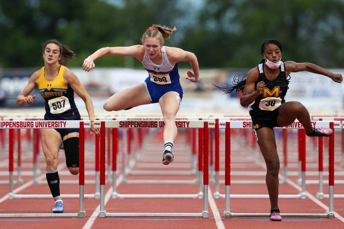 Saint Joseph’s Clare Marsh, center, competes in the girls Class 2A 100 meter hurdles finals during the PIAA State Track and Field Championships held Friday at Seth Grove Stadium on the Shippensburg University campus in Shippensburg, PA.Matthew O’Haren/For the Centre Daily Times