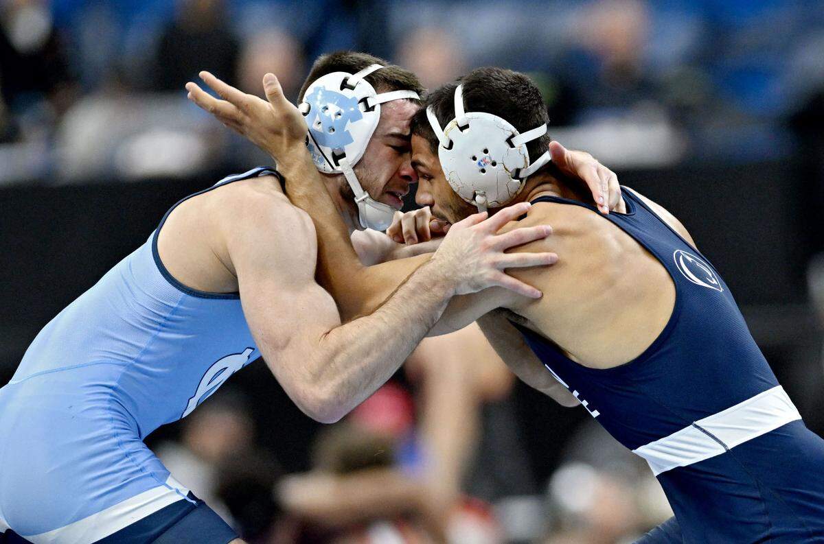 UNC’s Lachlan McNeil and Penn State’s Shayne Van Ness face off in a 149-pound quarterfinal bout during the 2025 NCAA Wrestling Championships in Philadelphia on Friday, March 21, 2025.