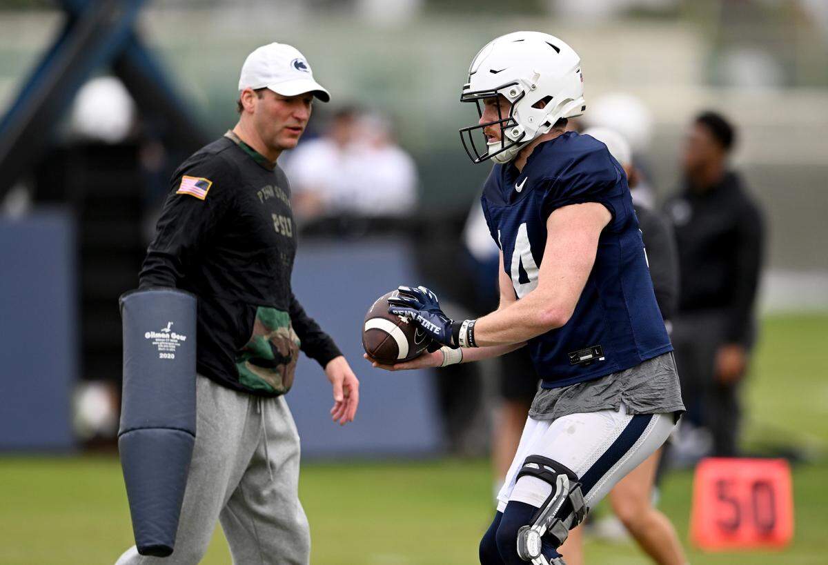 Penn State offensive coordinator Mike Yurcich watches quarterback Sean Clifford run a drill during practice for the Rose Bowl at Dignity Health Sports Park in Los Angeles on Thursday, Dec. 29, 2022.