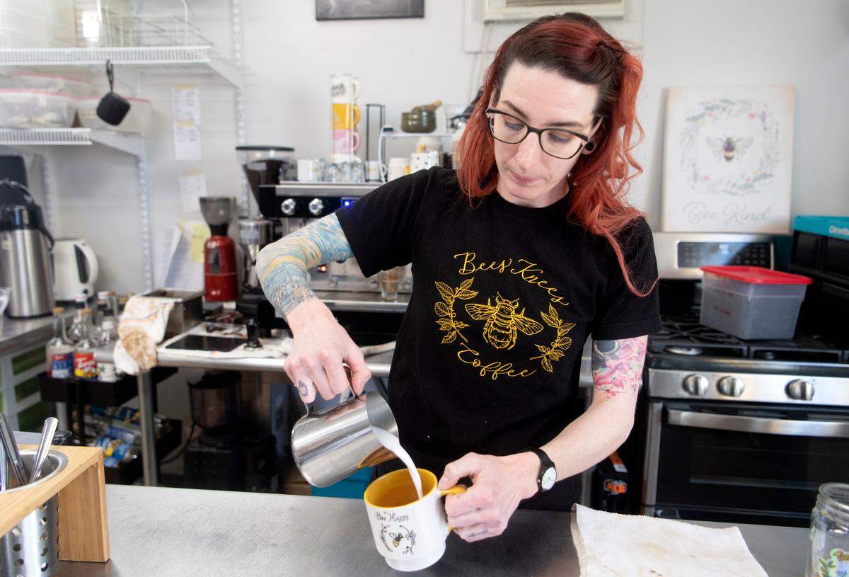 Bromlyn Fitzgerald of Bees Knees Coffee makes a latte on Wednesday.