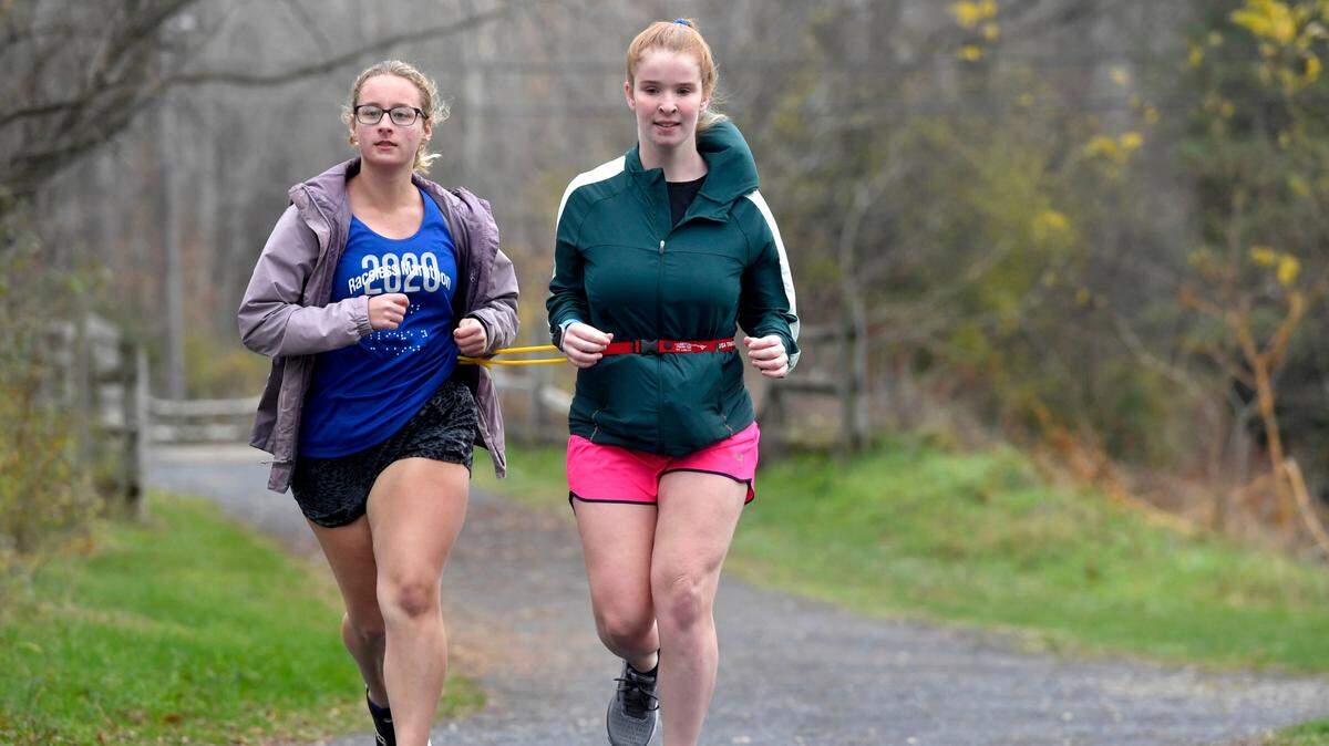 Devin Adams, right, runs with Penn State club cross-country teammate Darcy Bowman on Thursday, Nov. 12, 2020.