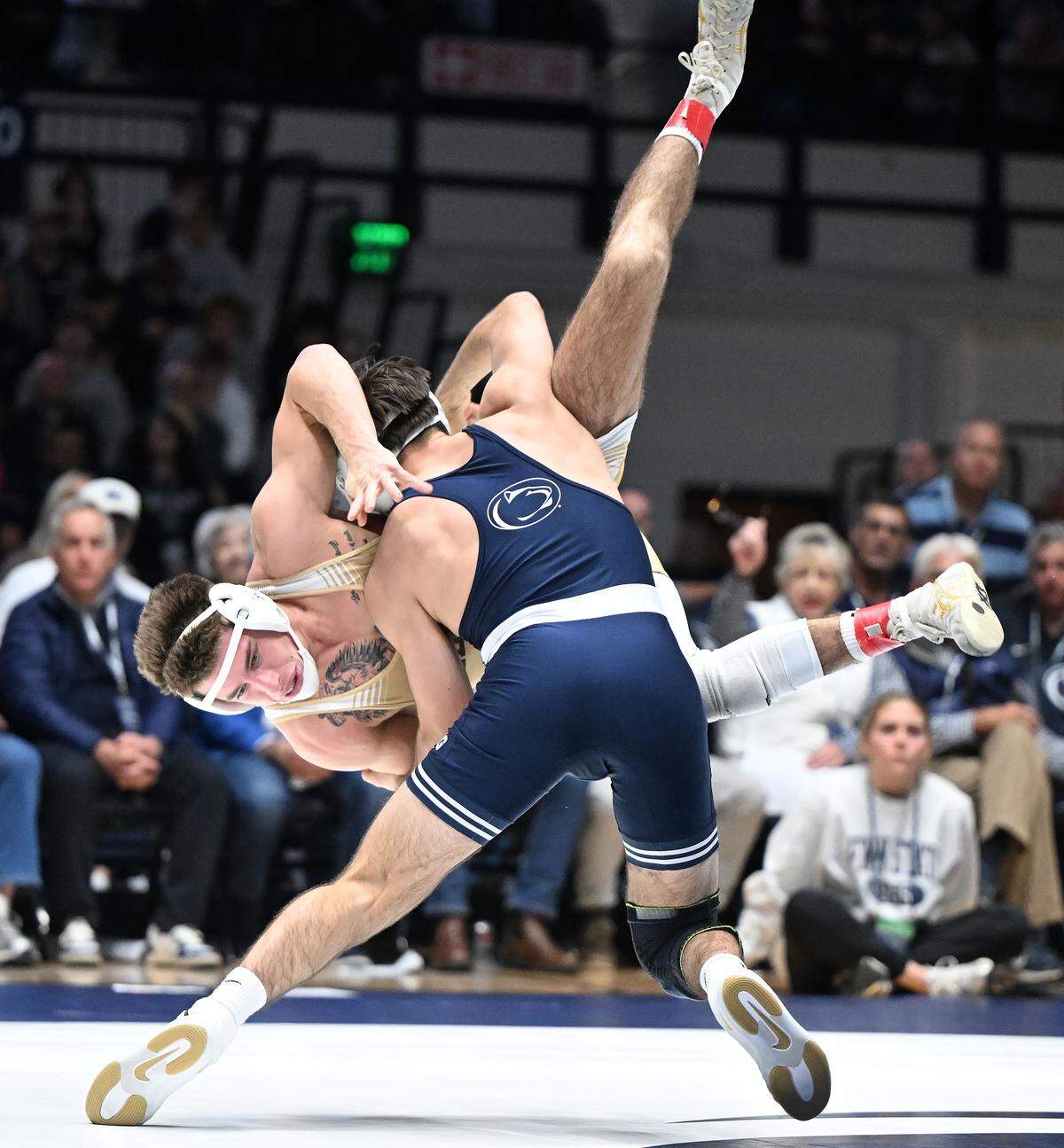 Penn State's PJ Duke takes down Lehigh's Logan Rozynski at 157 pounds during the Sunday, Dec. 7, 2025 match at Rec Hall in State College. Duke won by injury default.
