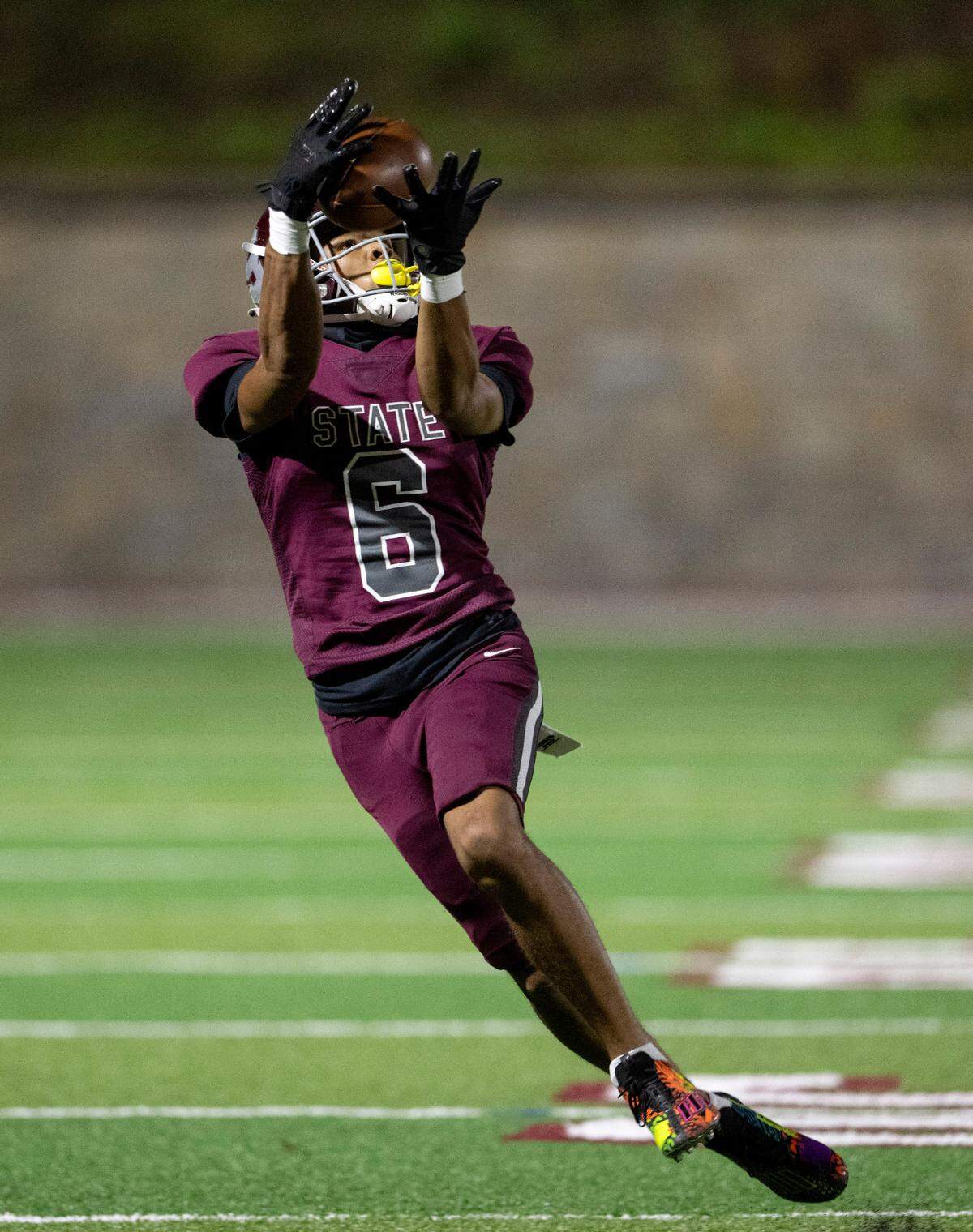 State College’s Daimear Coad makes a catch and runs it in for a touchdown during the game against Altoona on Friday, Sept. 15, 2023.