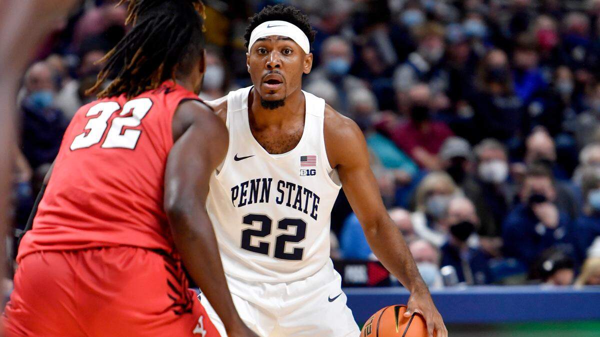 Penn State’s Jalen Pickett dribbles around a Youngstown State defender during the game on Wednesday, Nov. 10, 2021.