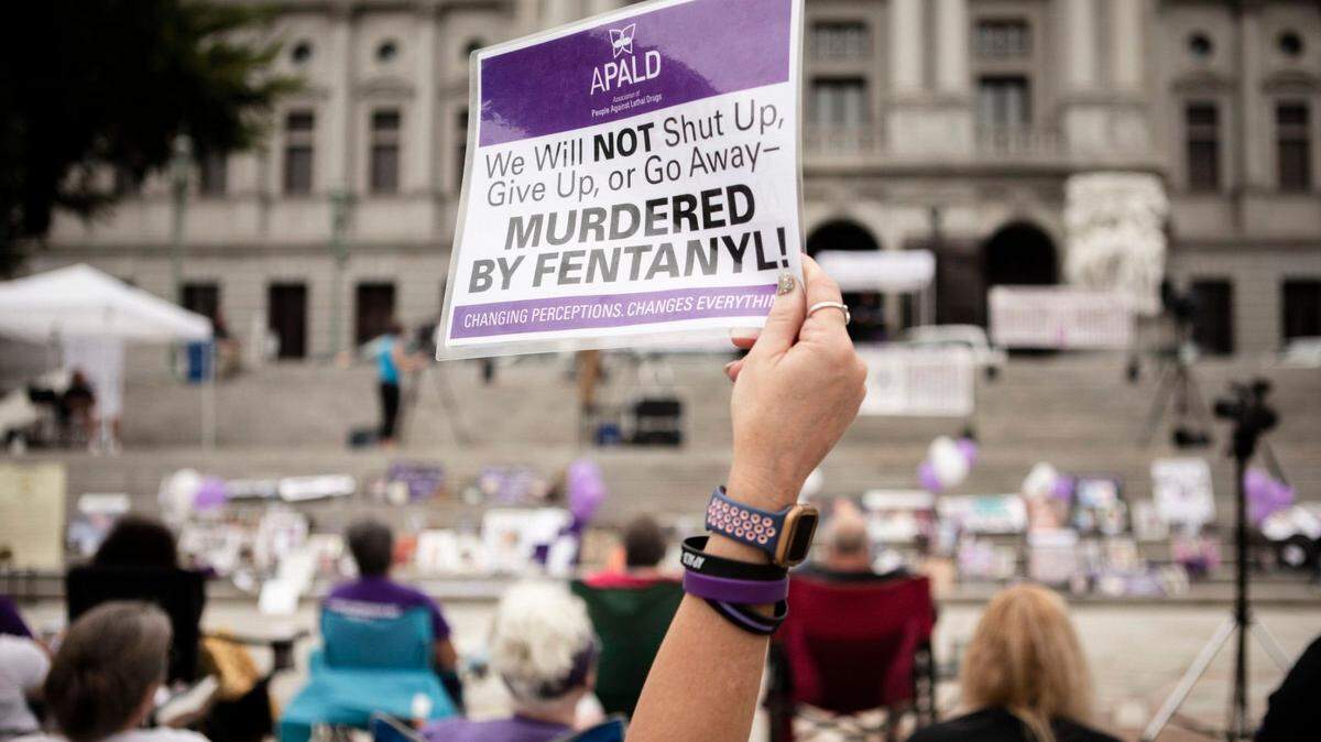 People gather on the steps of the Pennsylvania State Capitol in Harrisburg to honor lives lost to addiction during 2021’s Overdose Awareness & Memorial Day.
