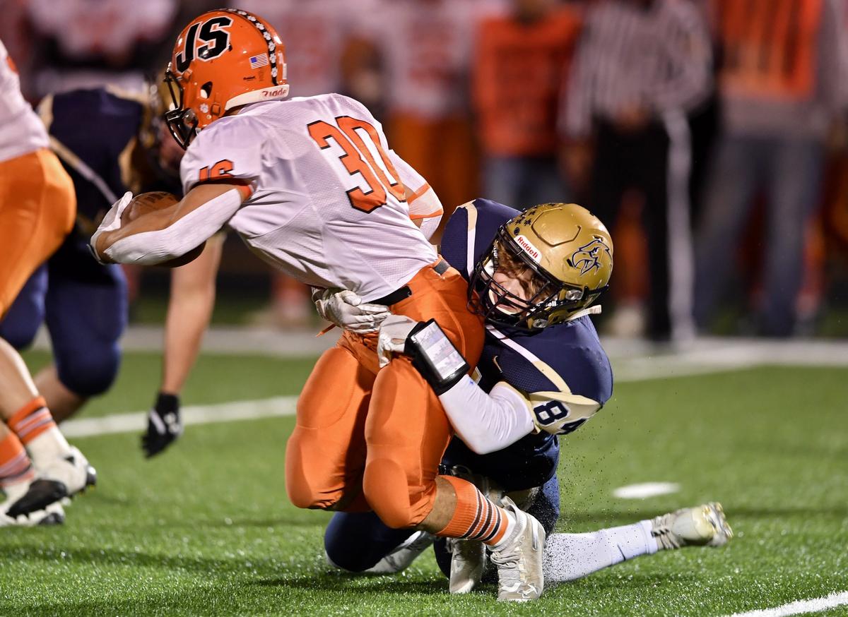 Bald Eagle Area’s Michael Lefebvre pulls down Jersey Shore’s Josh Malicky during the game on Friday, Oct. 18, 2019.