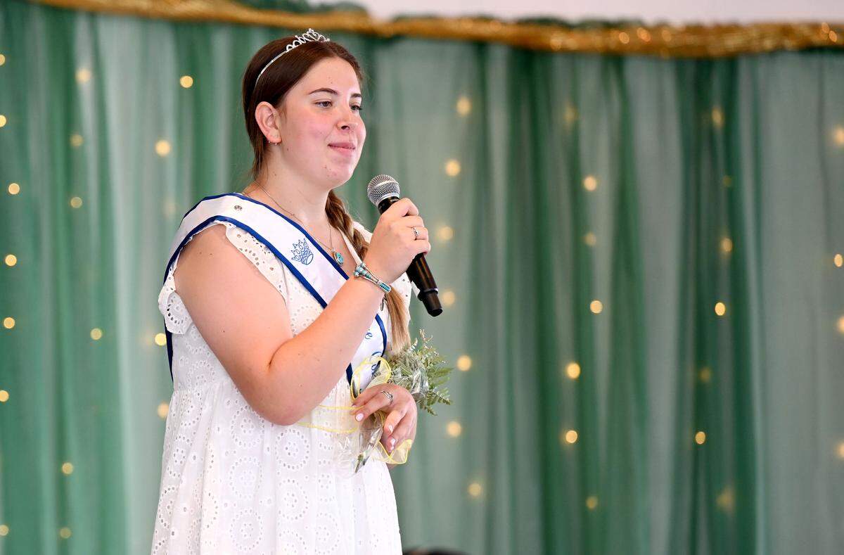 Junior Ambassador Emma Walizer shares her favorite fair food during the 2025 Centre County Grange Fair Queen coronation on Wednesday, Aug. 13, 2025. 