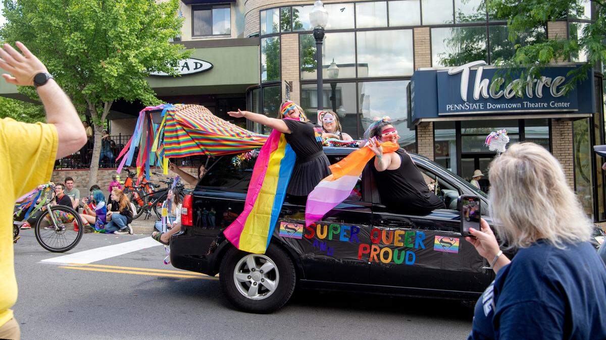 Community members line Allen Street for the State College “Pride Ride” parade on Saturday, June 11, 2022.