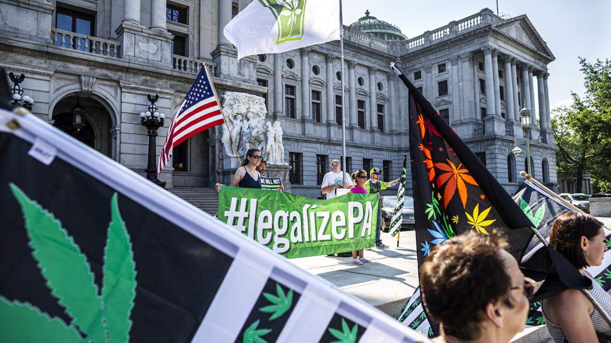 Marijuana legalization advocates remind state legislators about the need for cannabis reform with a rally on the Capitol steps in Harrisburg in June 2021.