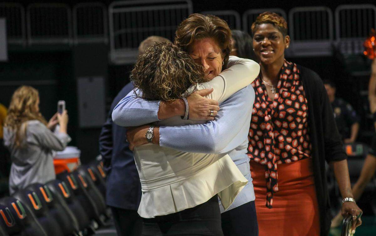 Miami Hurricanes women’s basketball coach Katie Meier hugs former Marquette Golden Eagles women’s basketball coach Carolyn Kieger on Nov. 15, 2018, at the Watsco Center in Miami, Florida.