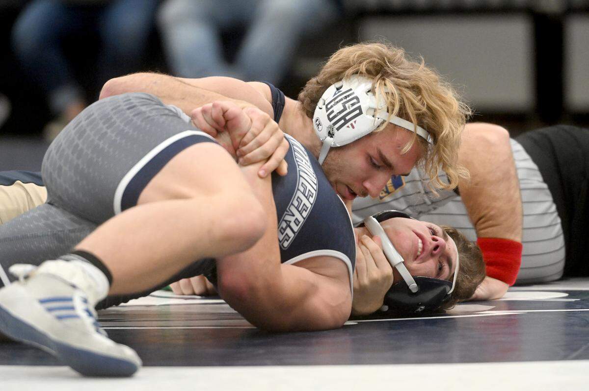 Bald Eagle Area’s Cameron Dubbs pins Philipsburg-Osceola’s Dylan Koptchak in the 160 lb bout of the match on Wednesday, Dec. 21, 2022.