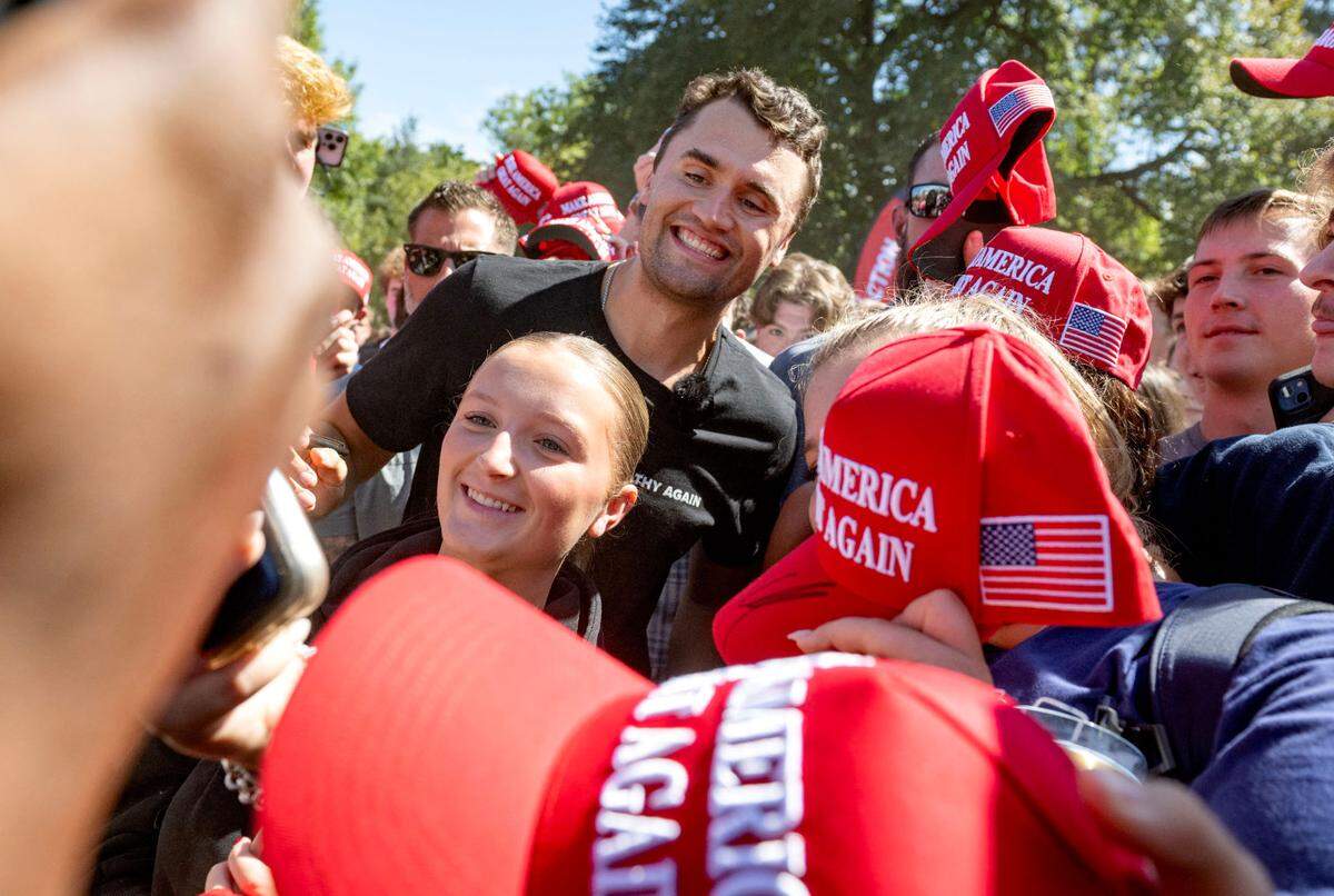 Charlie Kirk takes selfies with students on Penn State’s HUB lawn on Thursday, Sept. 19, 2024. Kirk handed out Make America Great Again hats and signed autographs.