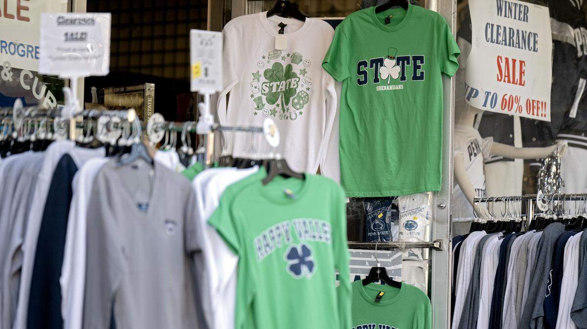 Green Penn State shirts are pictured for sale at Lion & Cub on Friday, Feb. 27, 2026. 