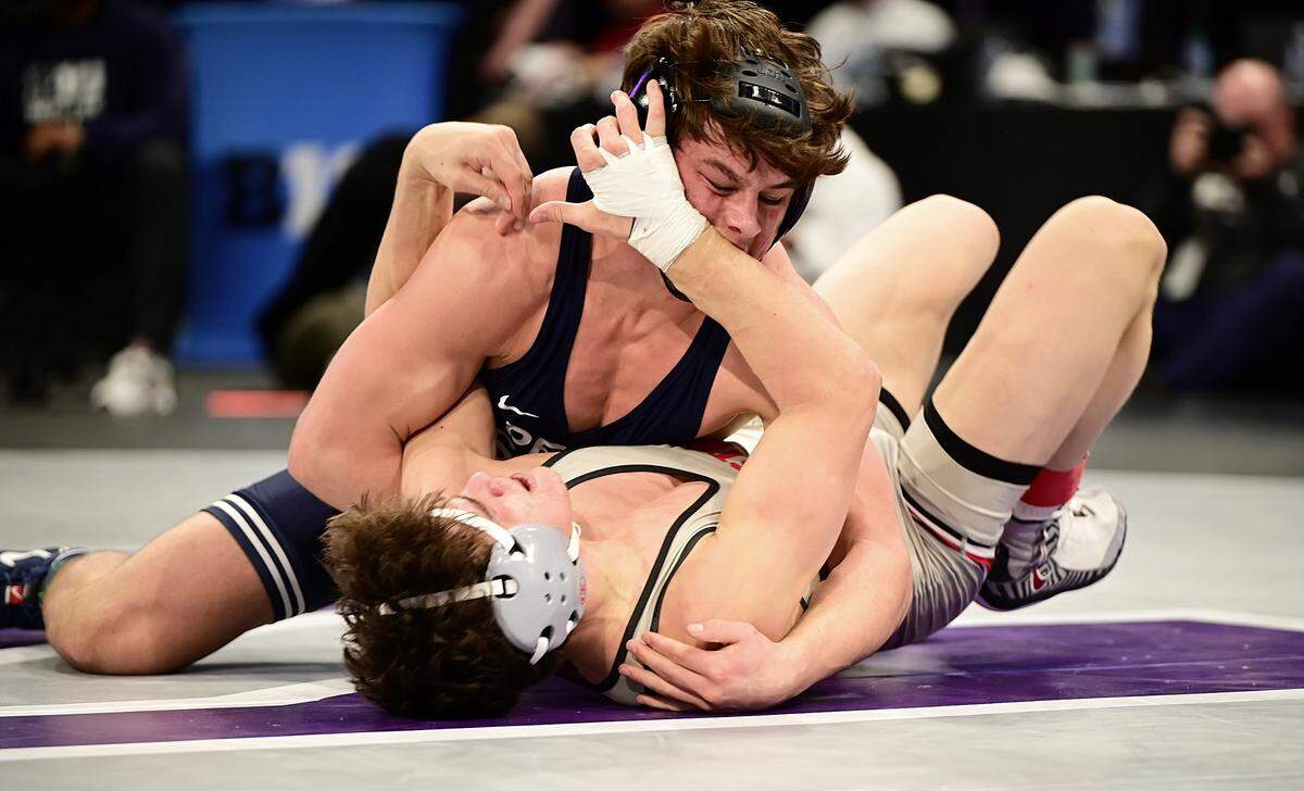Penn State’s Tyler Kasak looks to pin Ohio State’s Brandon Cannon in their 157-pound finals match of the Big Ten championships on Sunday inside Welsh Ryan Arena in Evanston, Ill. Kasak defeated Cannon, 12-2, for his first conference crown.
