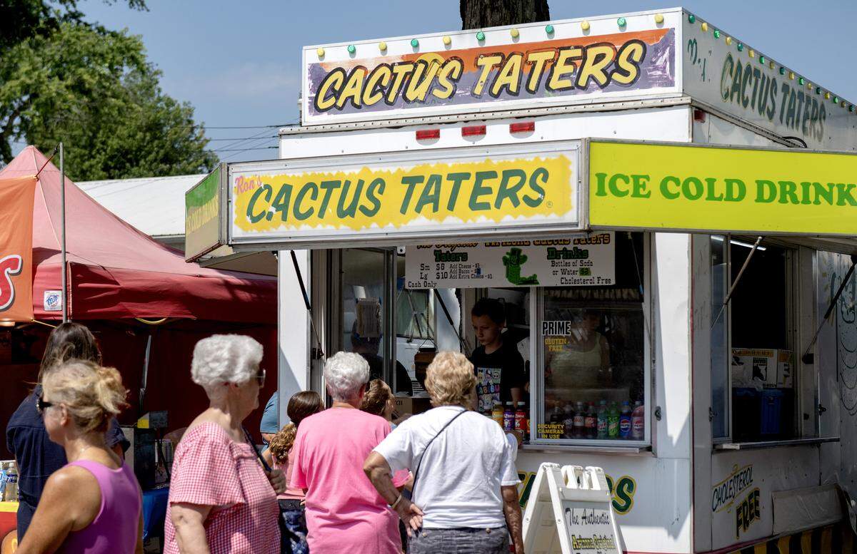 Fair goers line up for cactus taters at the Centre County Grange Fair on Friday, Aug. 15, 2025.