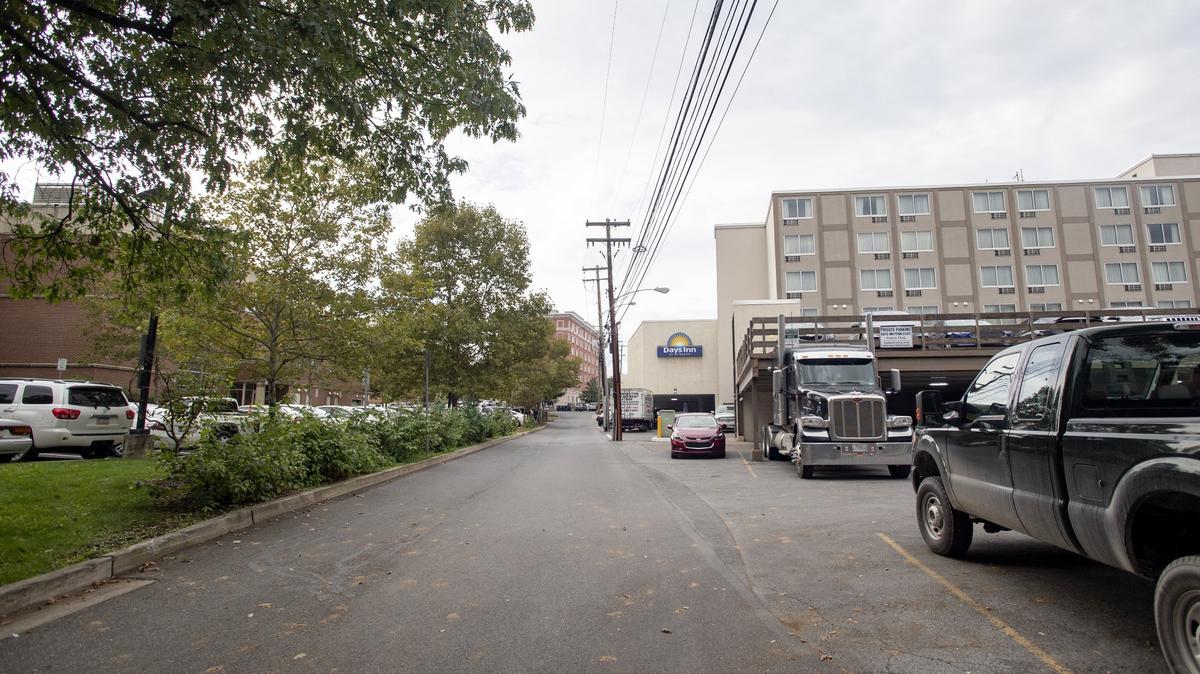 A new parking structure would be built between the Days Inn and the State College Municipal Building.