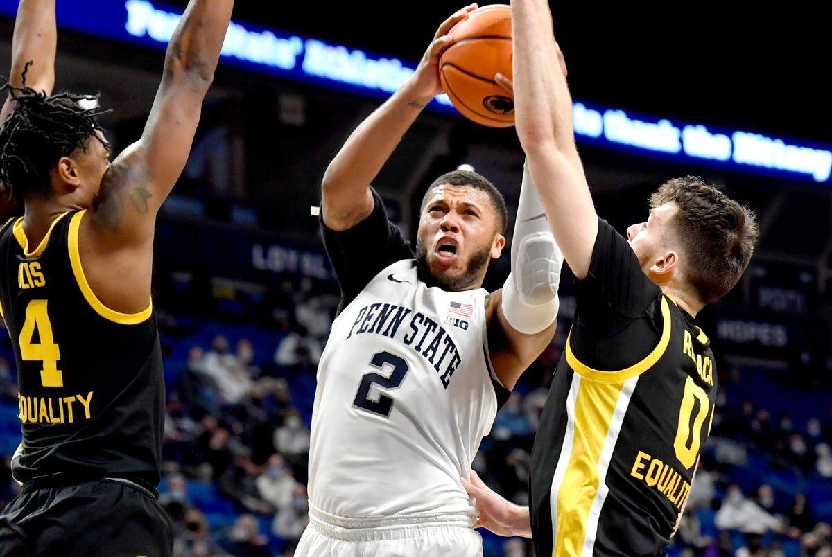 Penn State’s Myles Dread looks to the basket between Iowa’s Ahron Ulis and Filip Rebraca during the game on Monday, Jan. 31, 2022.