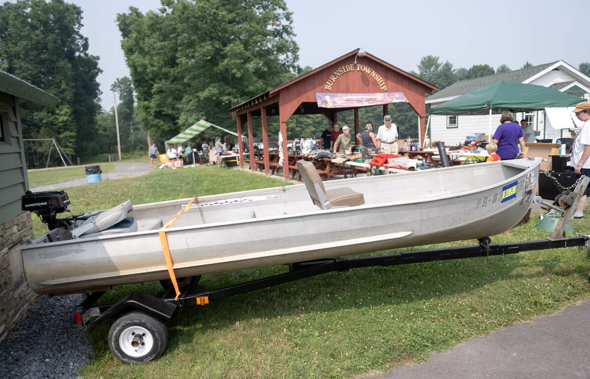 A boat for sale at Burnside Township Park during the 100 Mile Yard Sale on Friday, July 17, 2026.
