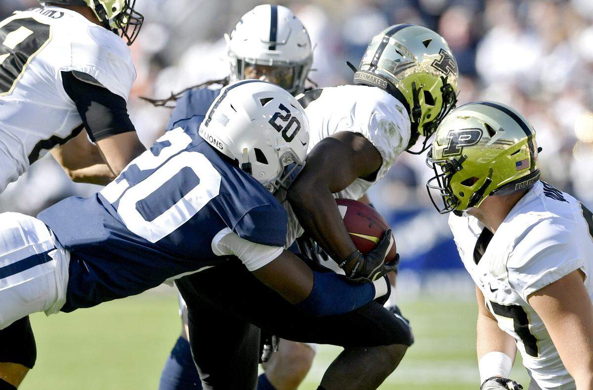 Penn State defensive end Adisa Isaac stops Purdue’s ball carrier during the game on Saturday Oct. 5, 2019.