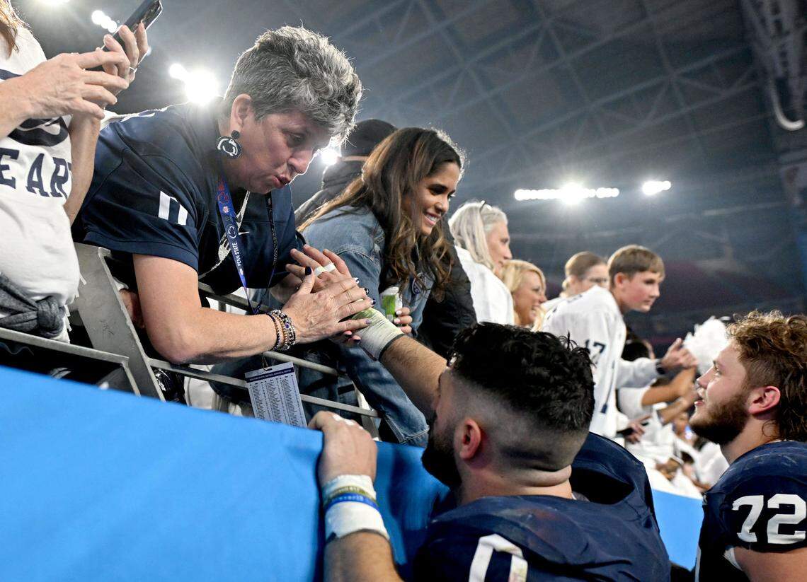 Penn State linebacker Dominic DeLuca greets family and fans after the win over Boise State in the Fiesta Bowl on Tuesday, Dec. 31, 2024 at State Farm Stadium.
