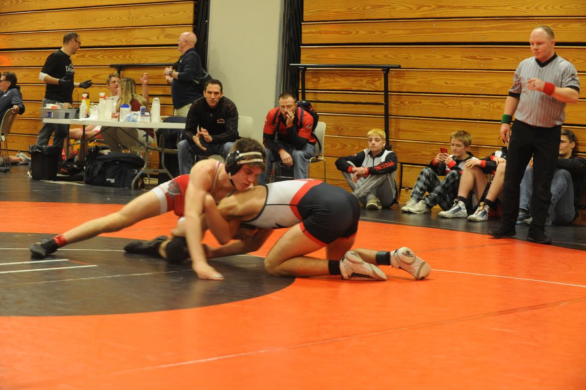 Bellefonte’s Ezra Swisher (left) aims to come around Central Cambria’s Jake Wilson in their 139-pound quarterfinals match of the Laurel Highlands Athletic Conference tournament on Friday at Tyrone. Swisher defeated Wilson, 6-0.