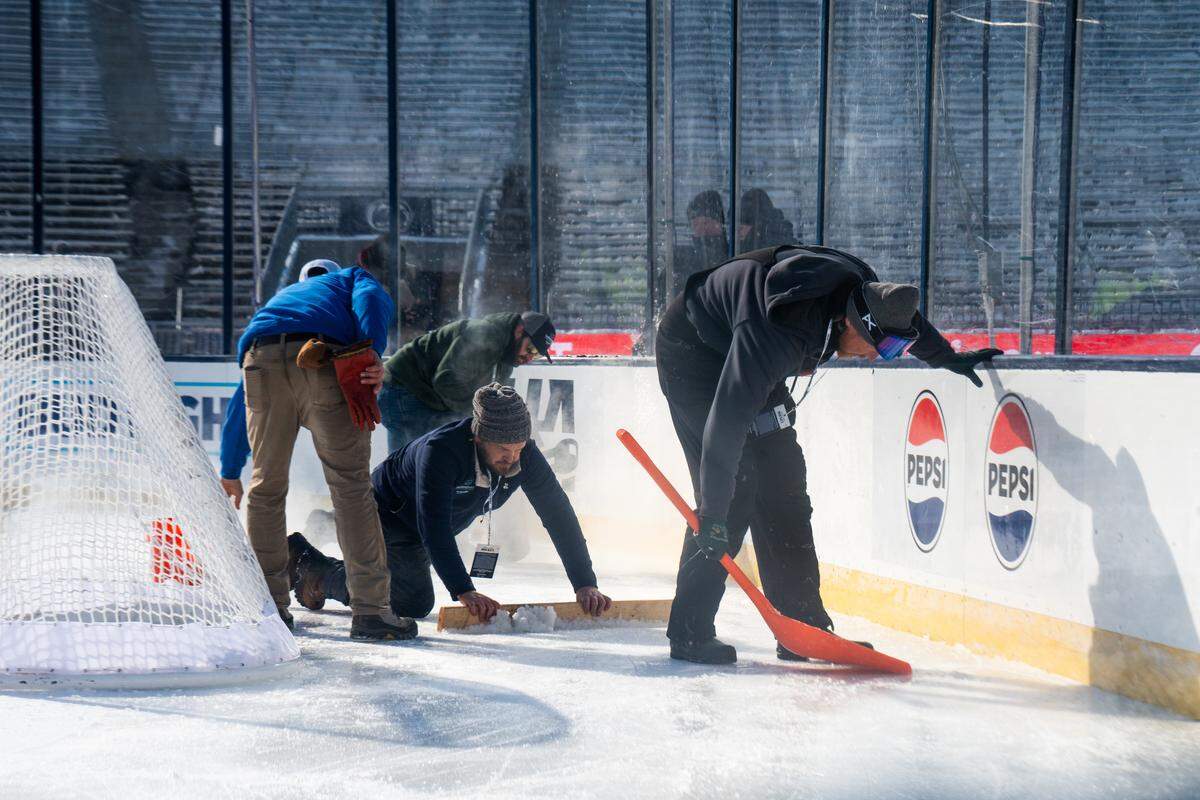 The ice maintenance crew conducts maintenance on the north western corner of the ice rink during the Penn State women’s hockey game at Beaver Stadium on Friday, Jan. 30, 2026.