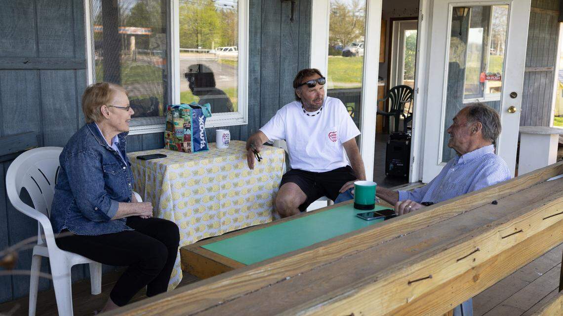 The Harner family sits on the porch at the Harner Farm at 3191 W. College Ave. on April 28, 2025. The family-run farm is celebrating its 80th anniversary in 2025.