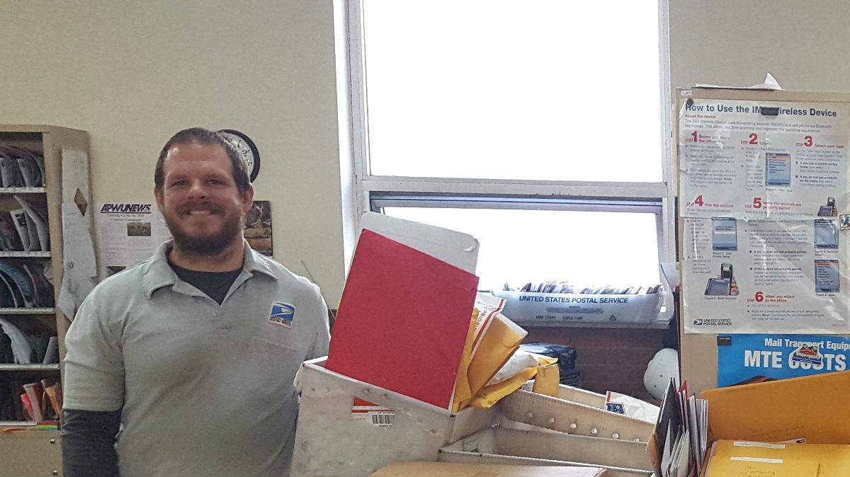 Mail carriers Toby Bullers, left, and Ali Walter prepare to deliver the mail to Maddox Hyde on Dec. 3, 2018. Hyde is a terminally ill DuBois Area Middle School student asking for Christmas cards to be sent to 333 Ohio St., Reynoldsville, PA, 15851.