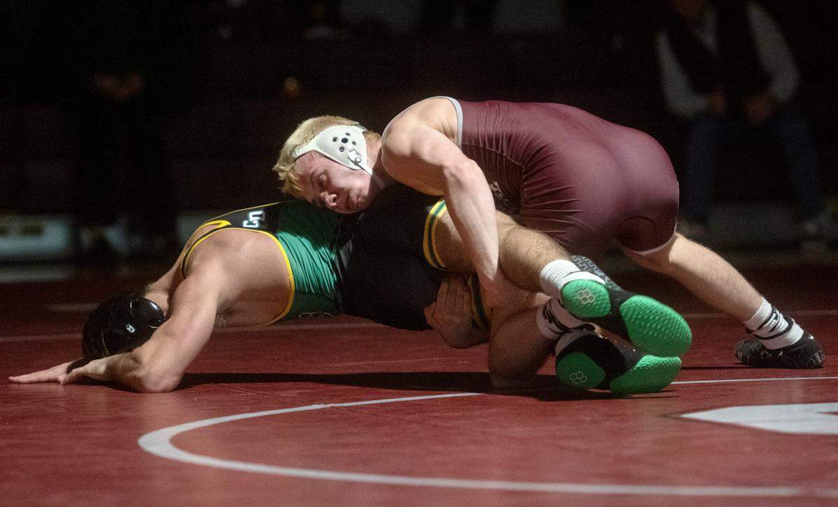 State College’s Pierson Manville controls Central Dauphin’s Matt Repos in the 145 lb bout of the match on Wednesday, Dec. 14, 2022. Manville won by decision, 1-0.