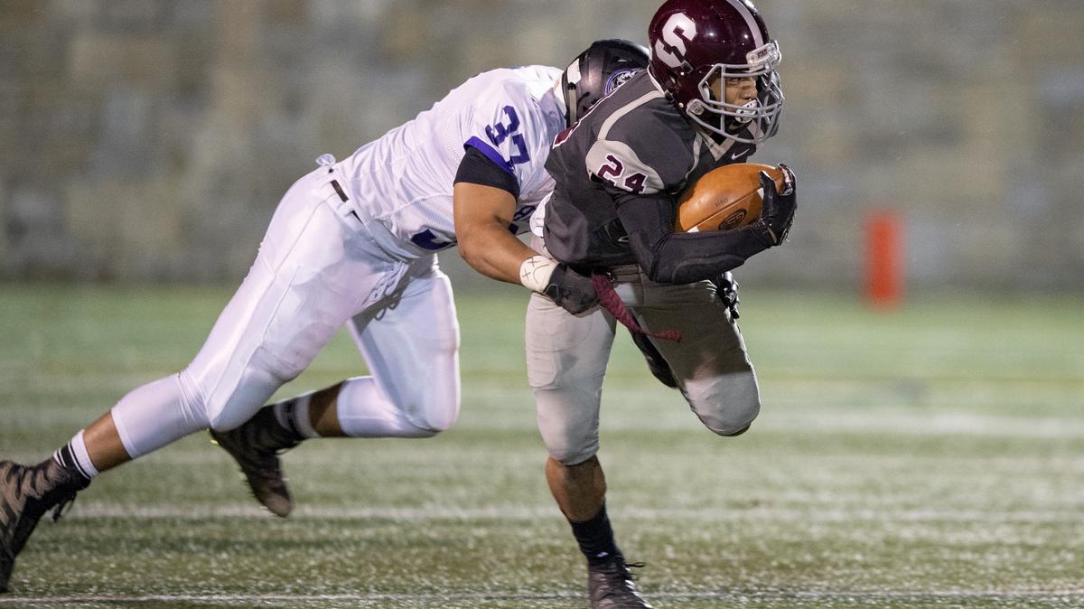 Mifflin County’s Taytdum Fortson tries to stop State College’s Dresyn Green during the District 6 6A title game on Friday, Nov. 2, 2018 at Memorial Field.