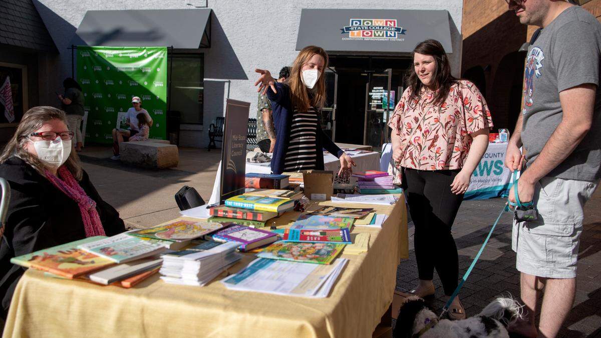 Community members learn more about the Mid-State Literacy Council and browse books during Centre Gives Fest on Wednesday, May 11, 2022 at the MLK Plaza.