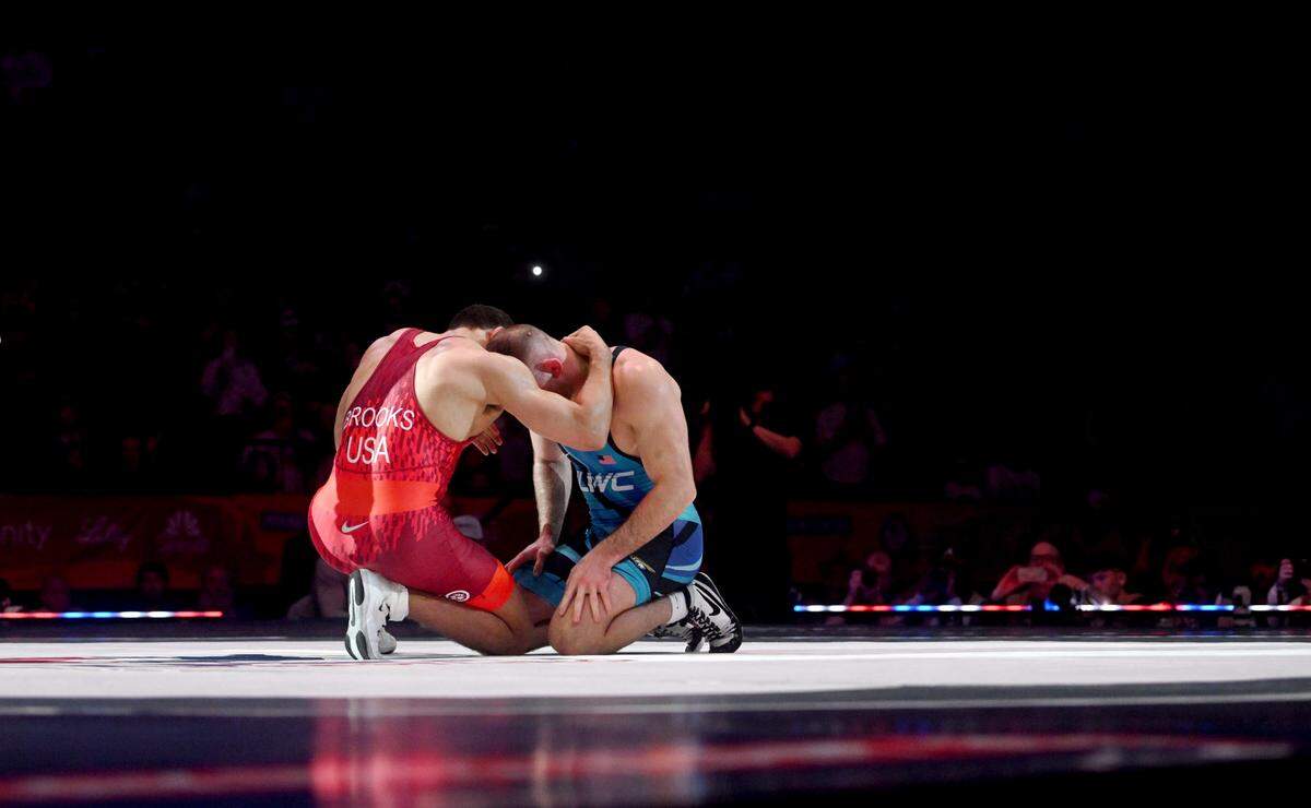 Aaron Brooks and David Taylor share a moment on the mat after Brooks won the bout to win the series at 86 kg at the U.S. Olympic Team Trials at the Bryce Jordan Center on Saturday, April 20, 2024. This photograph was awarded first place in the Sports Action Photo category in the 2025 Keystone Media Awards.