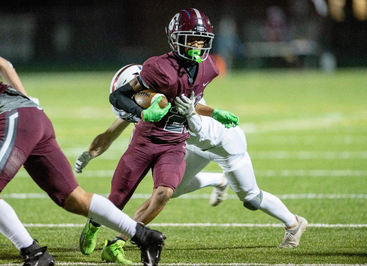 State College’s Donte Nastasi cuts down the field from Altoona defenders for a touchdown during the District 6 6A championship game at Bald Eagle Area on Thursday, Nov. 10, 2022. State College won, 28-7.