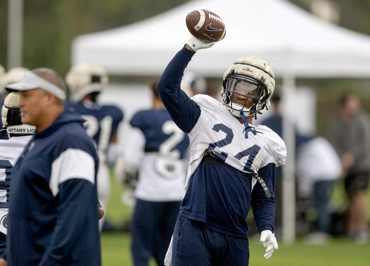 Penn State running back Keyvone Lee tosses the ball to a teammate to run a drill during practice for the Rose Bowl on Friday, Dec. 30, 2022 at Dignity Health Sports Park.