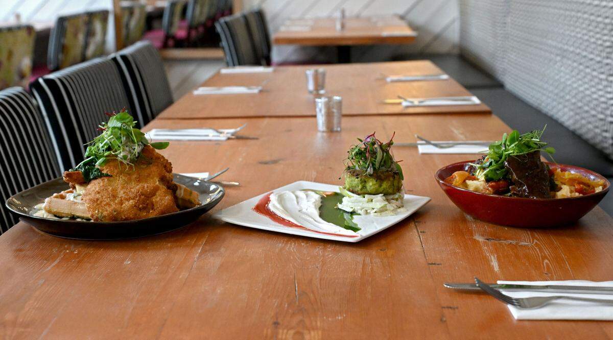 New menu items at Gigi’s Southern Table including the southern deconstructed chicken & waffle, jumbo lump crab cake and southern IBC braised short rib.