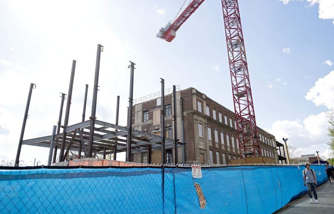 Students walk by as renovations continue on the Sackett Building on the Penn State campus on Wednesday, April 22, 2026.  