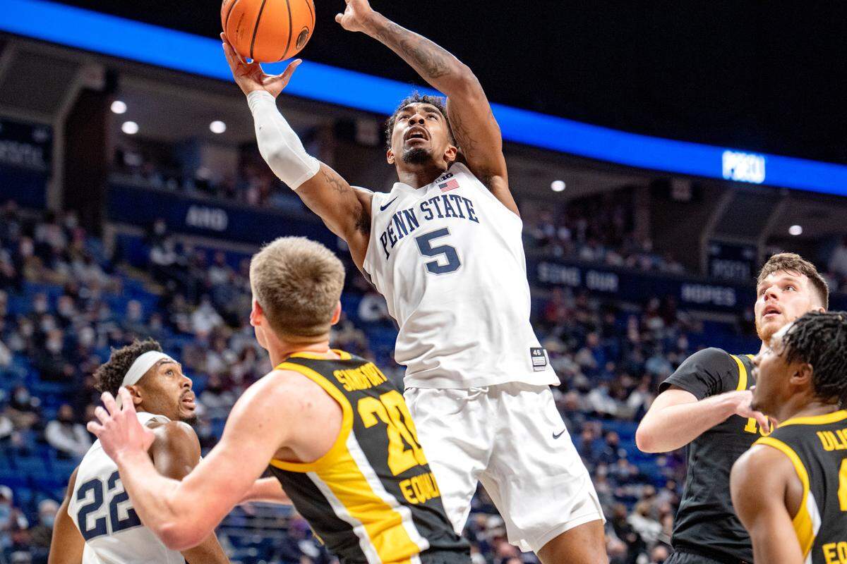 Penn State’s Greg Lee gets the rebound and makes a shot over Iowa defenders during the game on Monday, Jan. 31, 2022.
