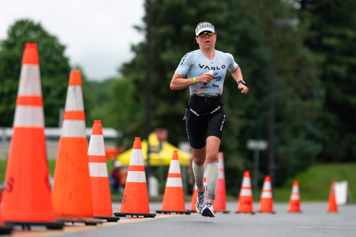 An athlete runs down University Drive in the third leg of the Ironman 70.3 Happy Valley on Sunday, June 15, 2025 in State College.