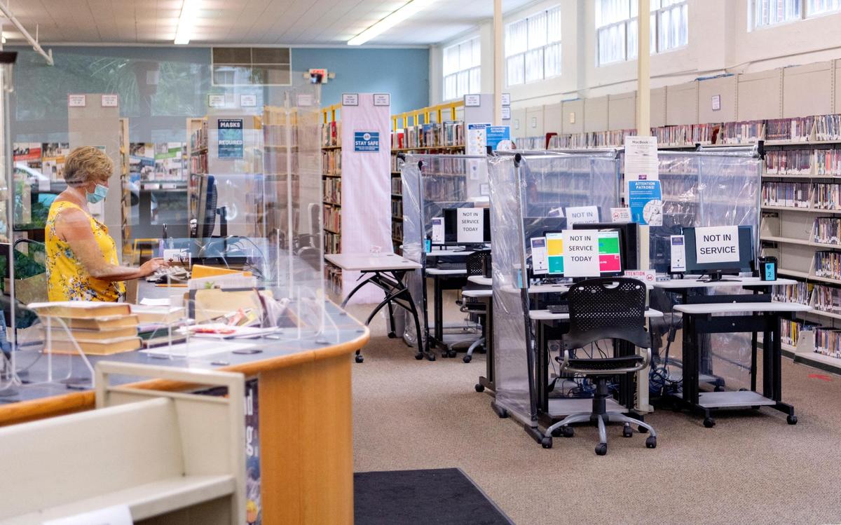Protective shields have been placed around the Bellefonte branch of the Centre County Library as it reopened to the public on Monday, August 3, 2020.