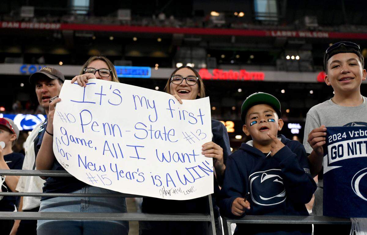 Penn State fans cheer as the team warms up for the Fiesta Bowl against Boise State at State Farm Stadium on Tuesday, Dec. 31, 2024.