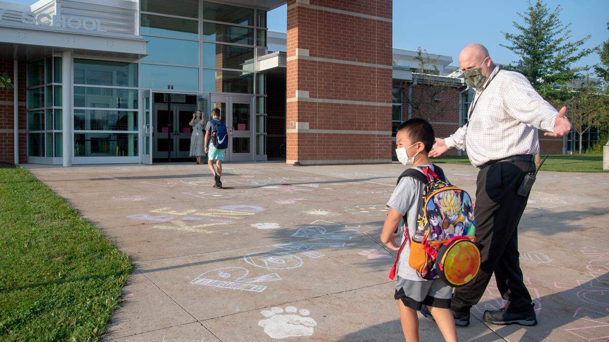 Mount Nittany Elementary principal Mark Feldman welcomes back students for their first day of school on Aug. 24. Fifth grade MNE students, who take classes in Panorama Village, recently moved to temporary remote learning due to COVID-19 cases.